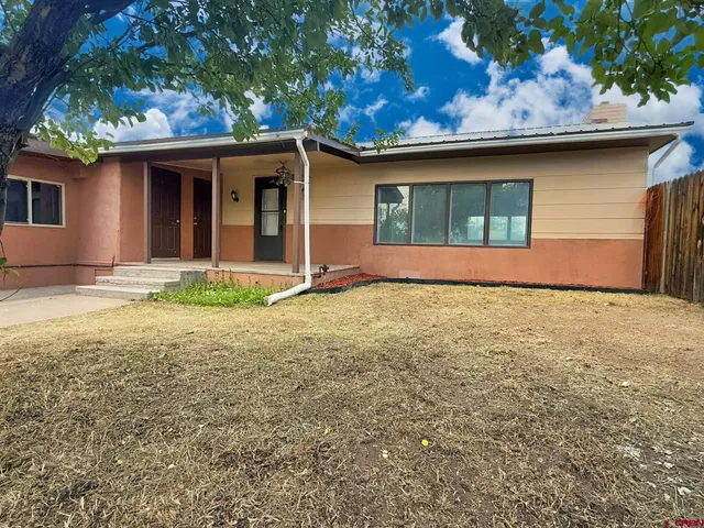 a front view of a house with yard