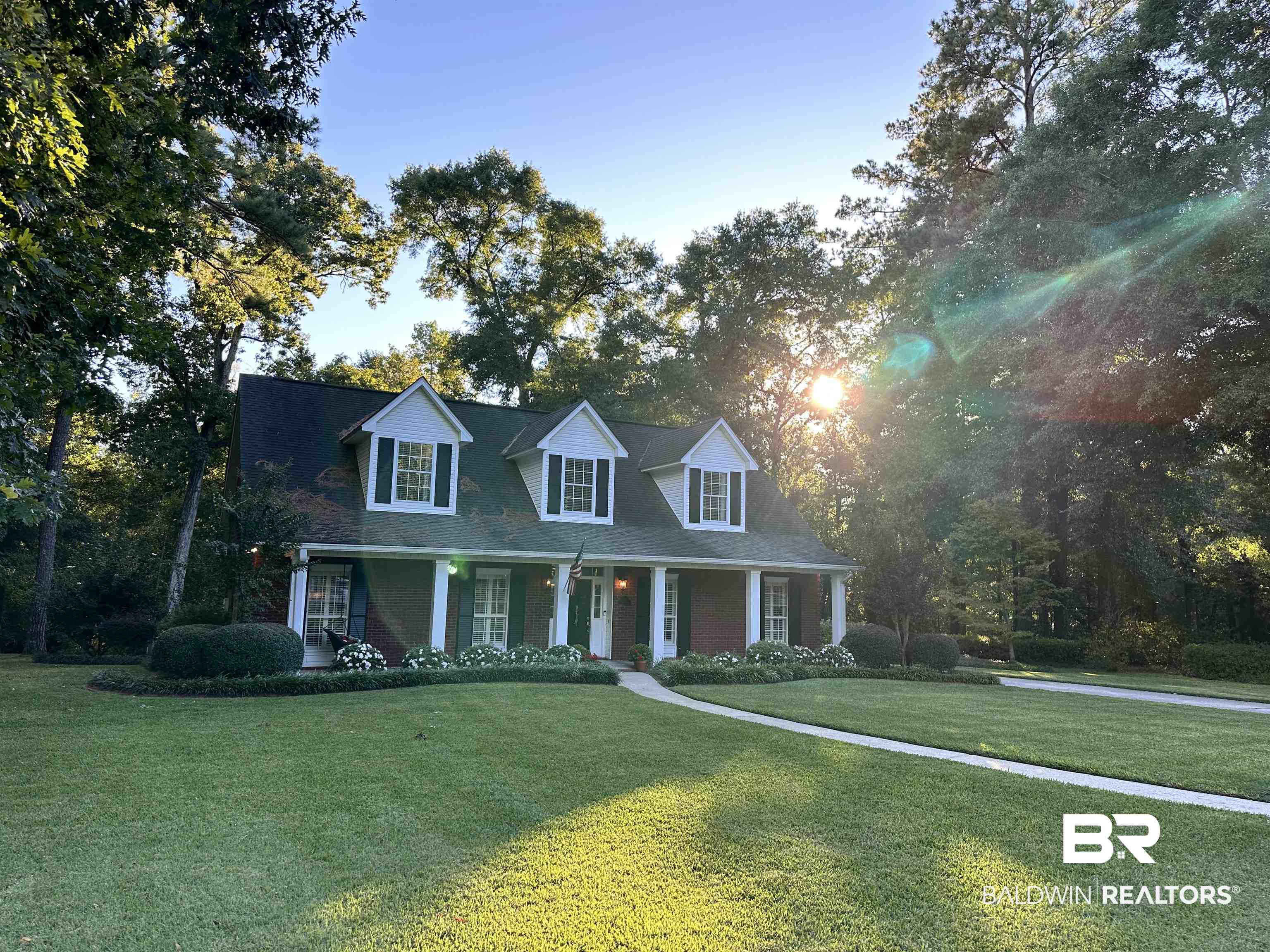 148 Brooks Boulevard Brewton, AL 36426 - Photo 1 of 45 New england style home featuring a front lawn