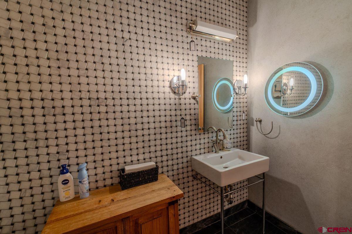 2180 Main Avenue Durango, CO 81301 - Photo 11 of 22 a bathroom with a sink mirror and toilet