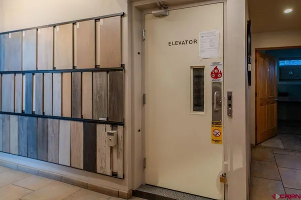 a lobby with furniture and a floor to ceiling window