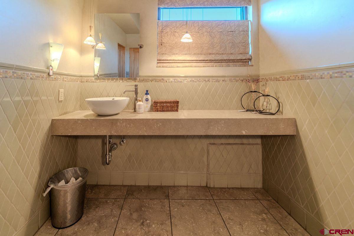 2180 Main Avenue Durango, CO 81301 - Photo 18 of 22 a bathroom with a sink and a mirror