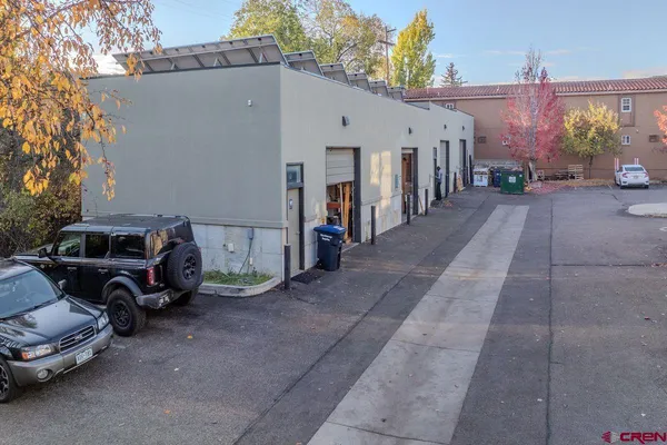a view of a car park in front of house