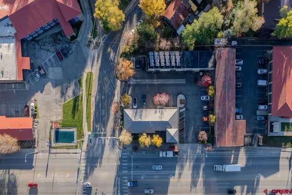a front view of house with a garden