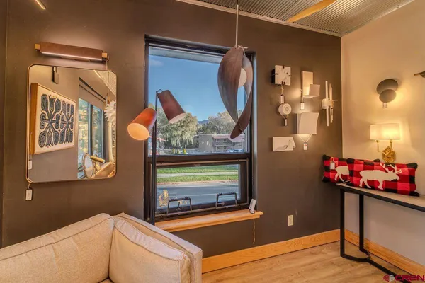 a view of a studio with wooden floor