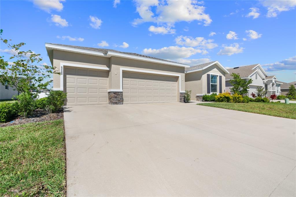 8260 Southwest 59th Avenue Ocala, FL 34476 - Photo 14 of 20 a front view of house with yard and trees