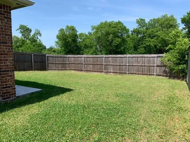 a view of a backyard with a small cabin
