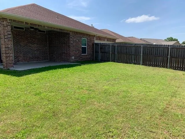 a view of a backyard with a garden