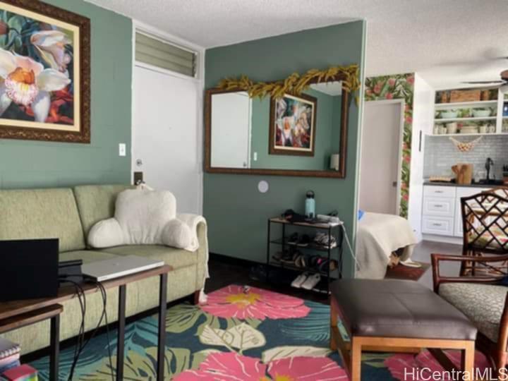 2649 Varsity Place, Unit 212 Honolulu, HI 96826 - Photo 1 of 14 a living room with furniture and a couch