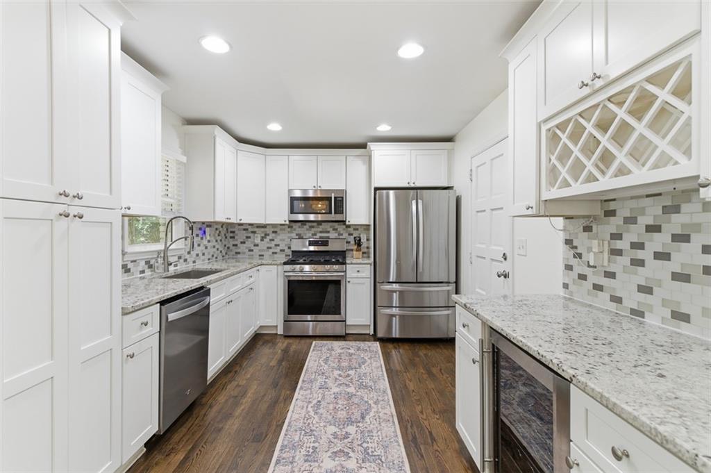 3180 Rehoboth Drive Decatur, GA 30033 - Photo 13 of 36 a kitchen with granite countertop appliances a sink and a refrigerator