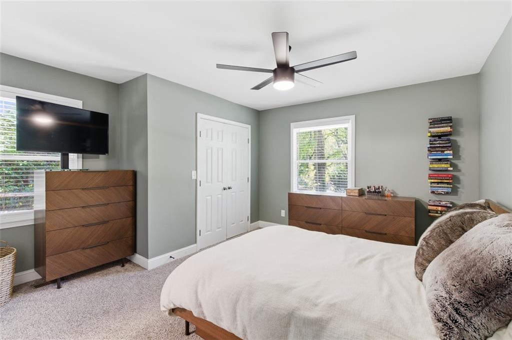 3180 Rehoboth Drive Decatur, GA 30033 - Photo 18 of 36 a bedroom with a bed and a flat screen tv