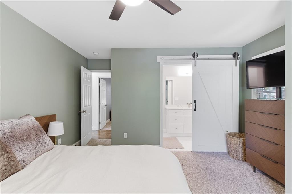 3180 Rehoboth Drive Decatur, GA 30033 - Photo 20 of 36 a bedroom with a bed and a television