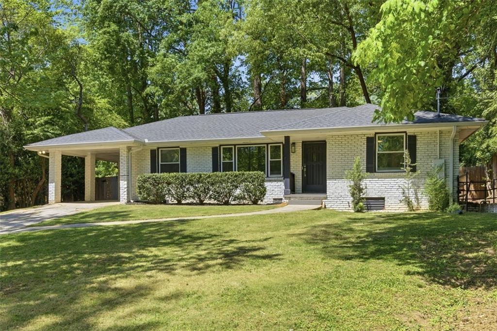 3180 Rehoboth Drive Decatur, GA 30033 - Photo 2 of 36 a big white house with a big yard and large trees