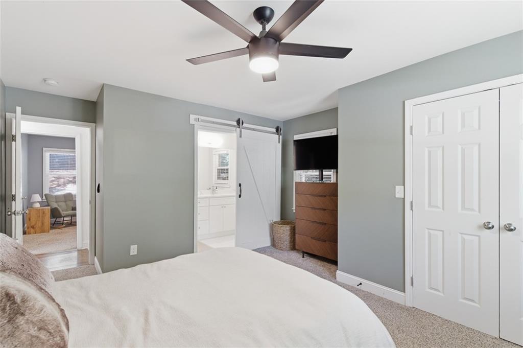 3180 Rehoboth Drive Decatur, GA 30033 - Photo 21 of 36 a bedroom with a bed and a ceiling fan