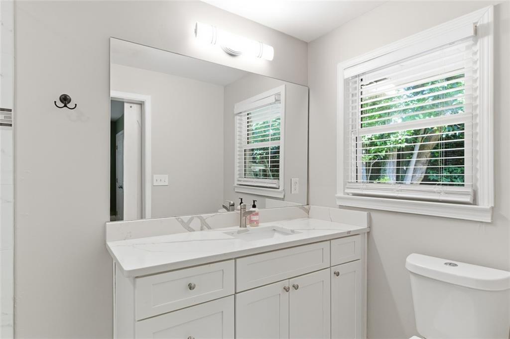 3180 Rehoboth Drive Decatur, GA 30033 - Photo 25 of 36 a bathroom with a sink a toilet and a window