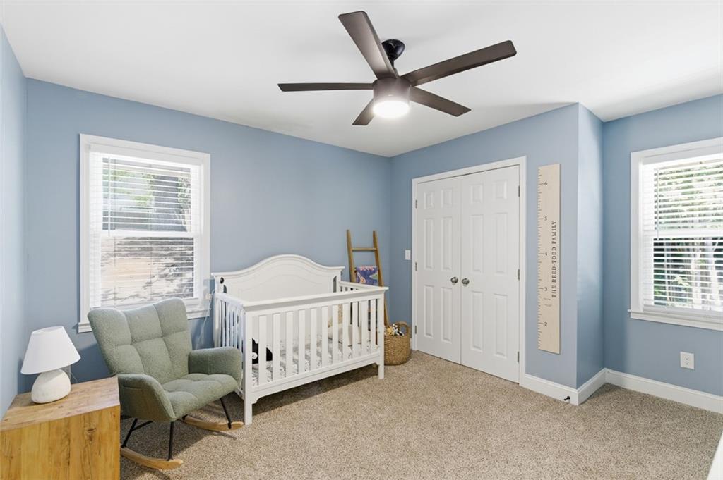 3180 Rehoboth Drive Decatur, GA 30033 - Photo 26 of 36 a bed sitting in a living room next to a window