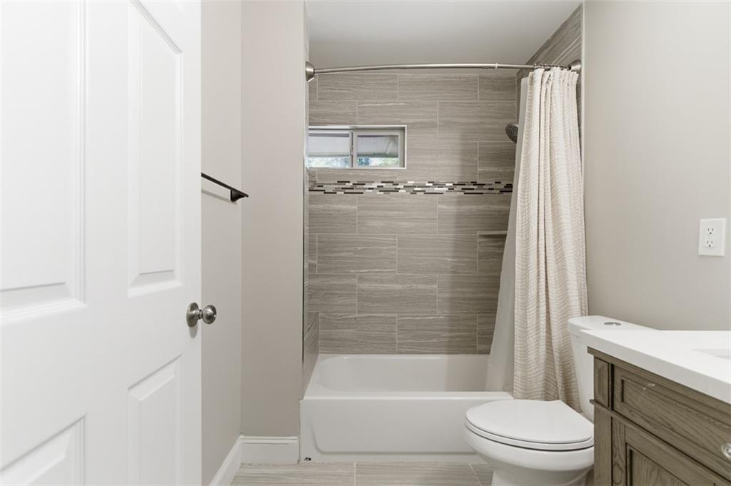 3180 Rehoboth Drive Decatur, GA 30033 - Photo 31 of 36 a bathroom with a shower and a toilet