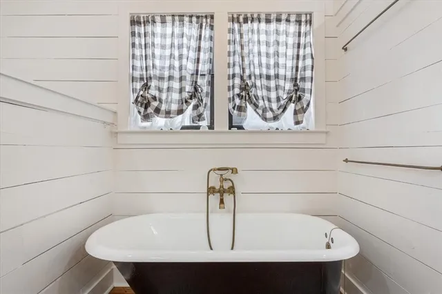 a bathroom with a bathtub and a sink