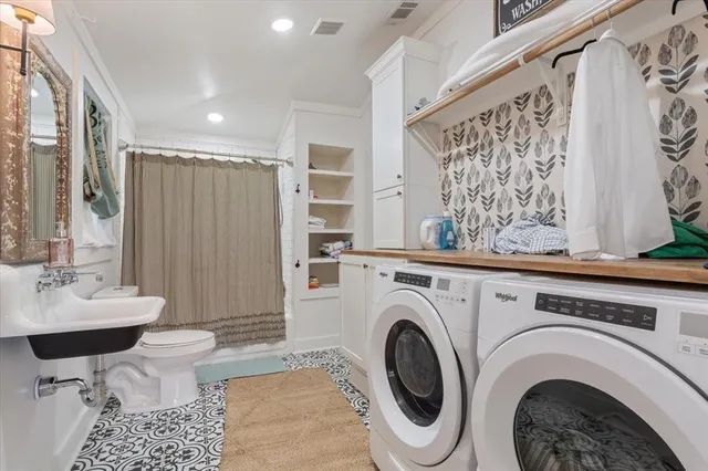 a view of a bathroom with toilet sink and a shower
