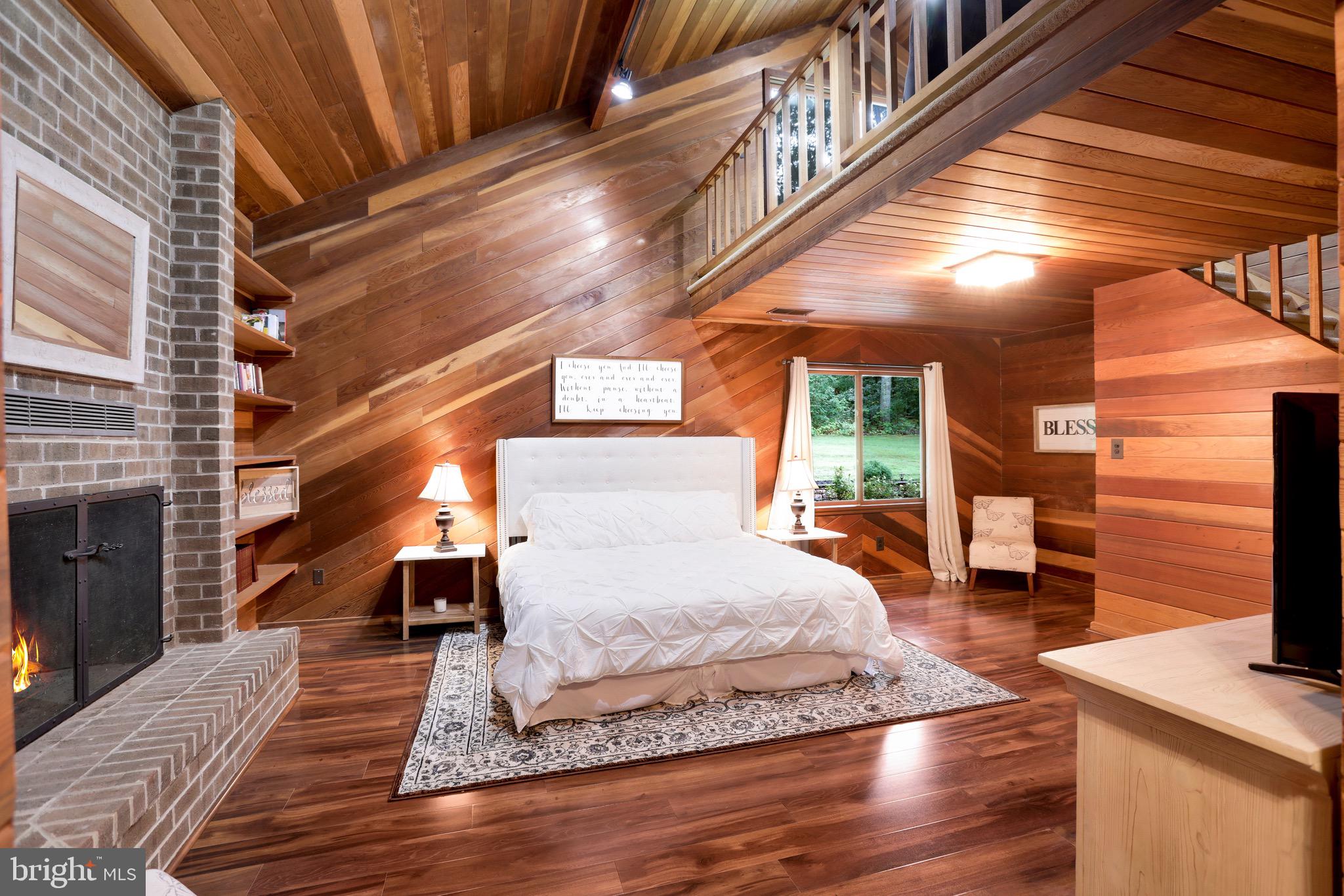43351 Spinks Ferry Road Leesburg, VA 20176 - Photo 27 of 48 Gorgeous wood panel walls in primary bedroom.