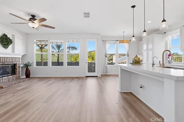 a view of a kitchen with wooden floor