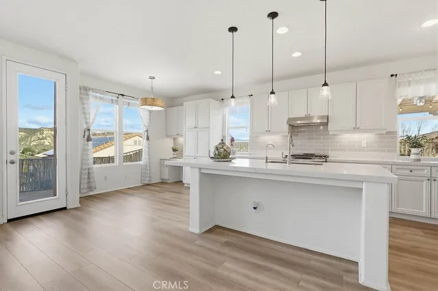 a view of an entryway with wooden floor