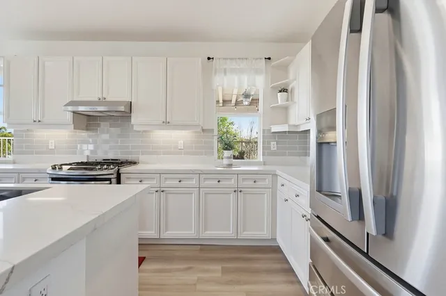 a bathroom with a sink mirror and toilet