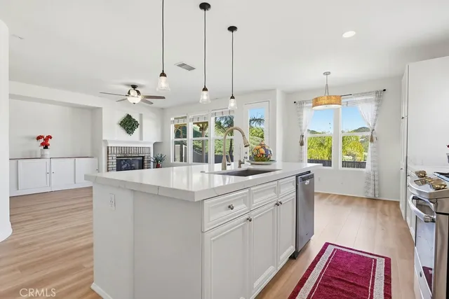 a view of a livingroom with a ceiling fan and window