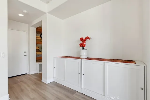 a view of entryway with wooden floor