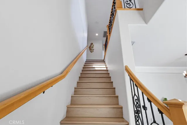 an empty room with ceiling fan and window