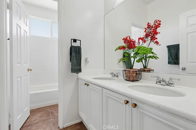 a balcony with wooden floor and city view