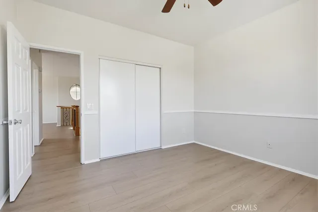 a view of a patio with a table chairs and a yard