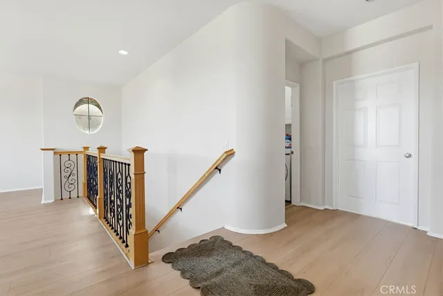 a view of a house with a yard and potted plants