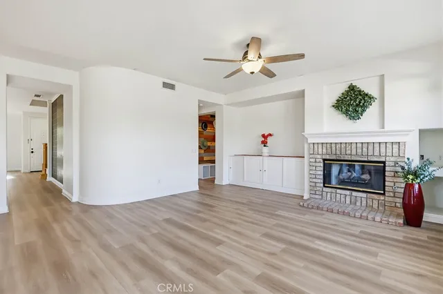 a view of an entryway with wooden floor and door