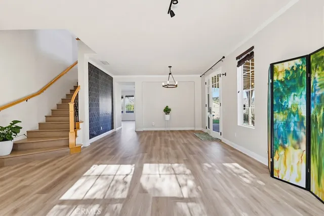 a view of an entryway with wooden floor