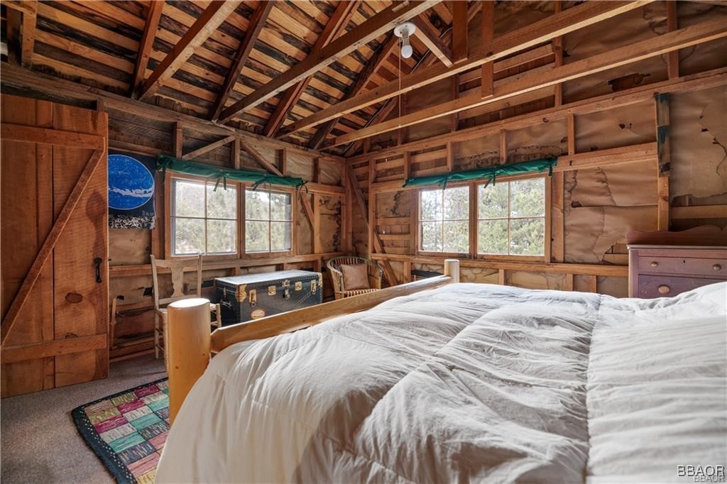 46 Spring Road Big Bear Lake, CA 92315 - Photo 13 of 43 a bed room with a bed and a chair