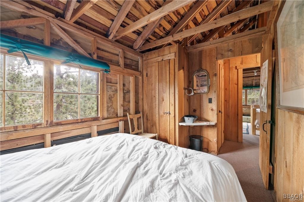 46 Spring Road Big Bear Lake, CA 92315 - Photo 19 of 43 a bedroom with a bed and a large window