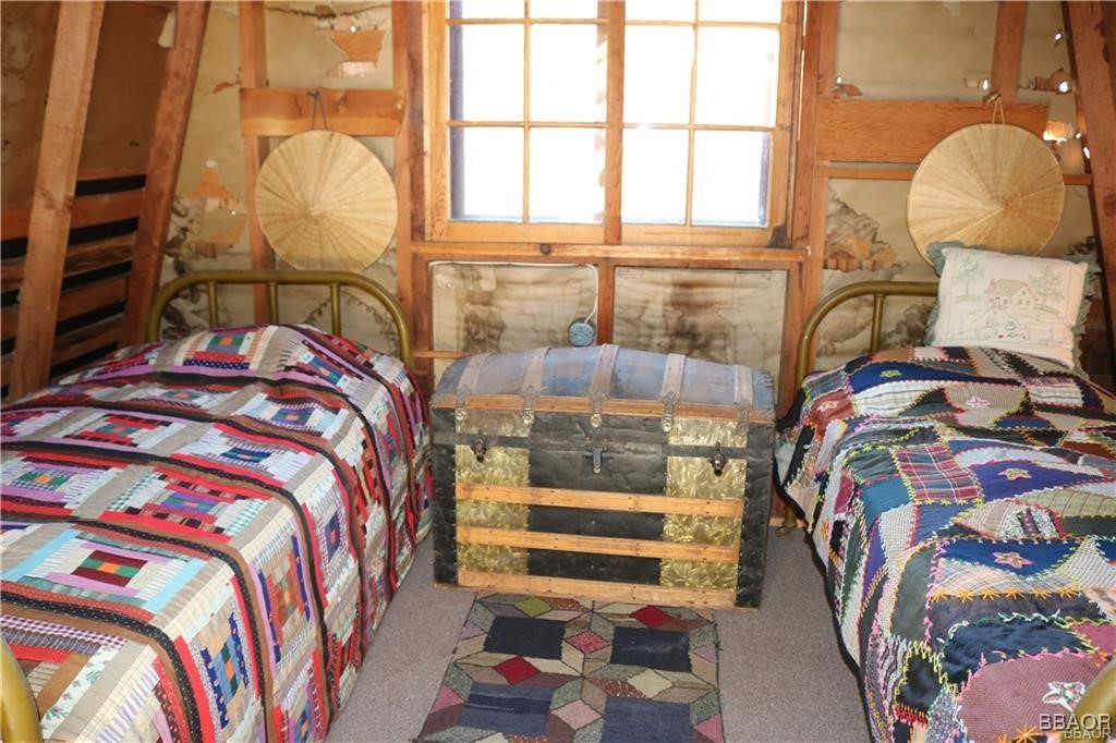 46 Spring Road Big Bear Lake, CA 92315 - Photo 23 of 43 a bedroom with a bed and a painting on the wall