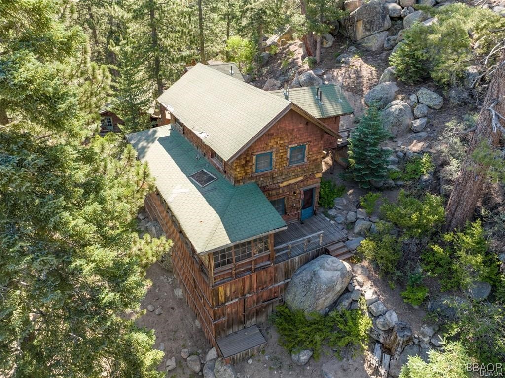 46 Spring Road Big Bear Lake, CA 92315 - Photo 29 of 43 a house with trees in front of it