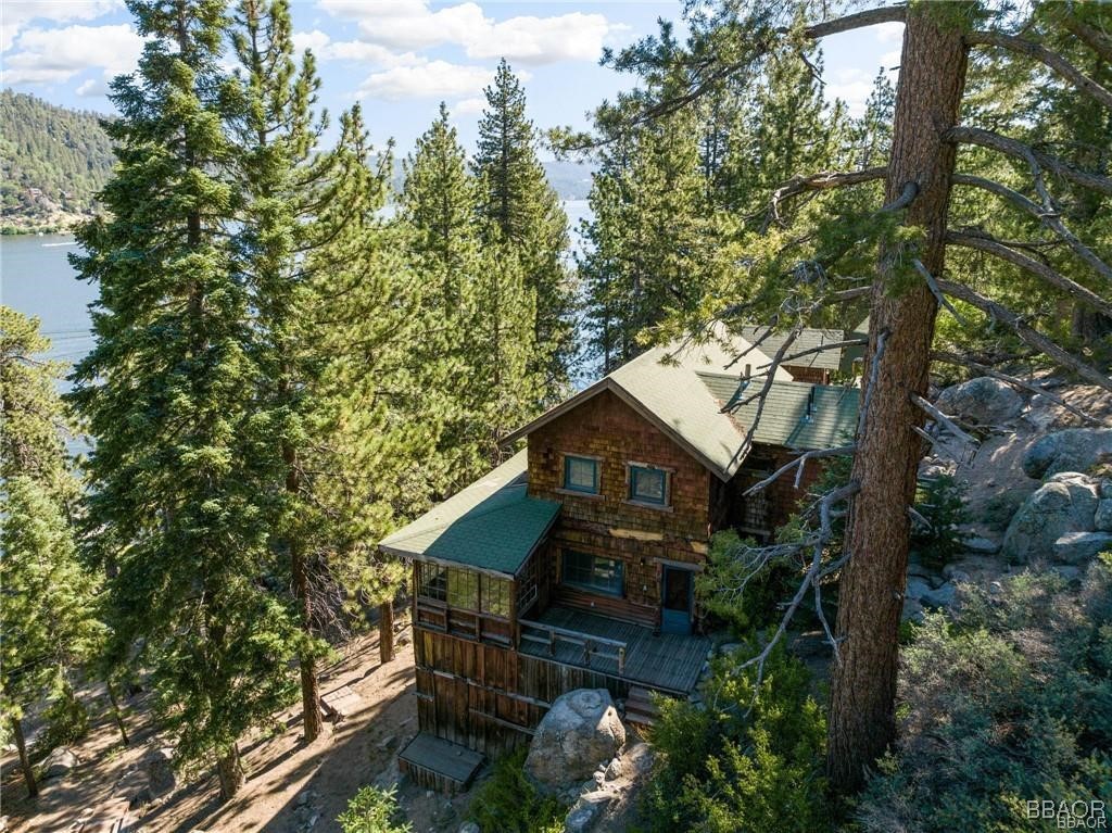 46 Spring Road Big Bear Lake, CA 92315 - Photo 35 of 43 a house with trees in front of it