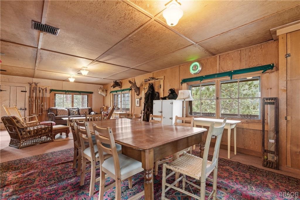 46 Spring Road Big Bear Lake, CA 92315 - Photo 7 of 43 a view of a dining room with furniture window and wooden floor