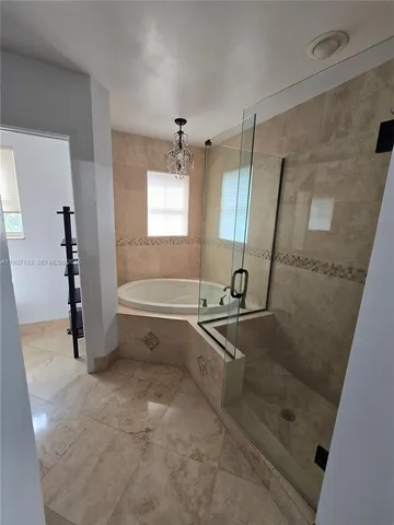 a bathroom with a bathtub and a sink