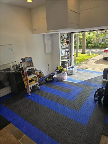 a room with gym equipment and a large window