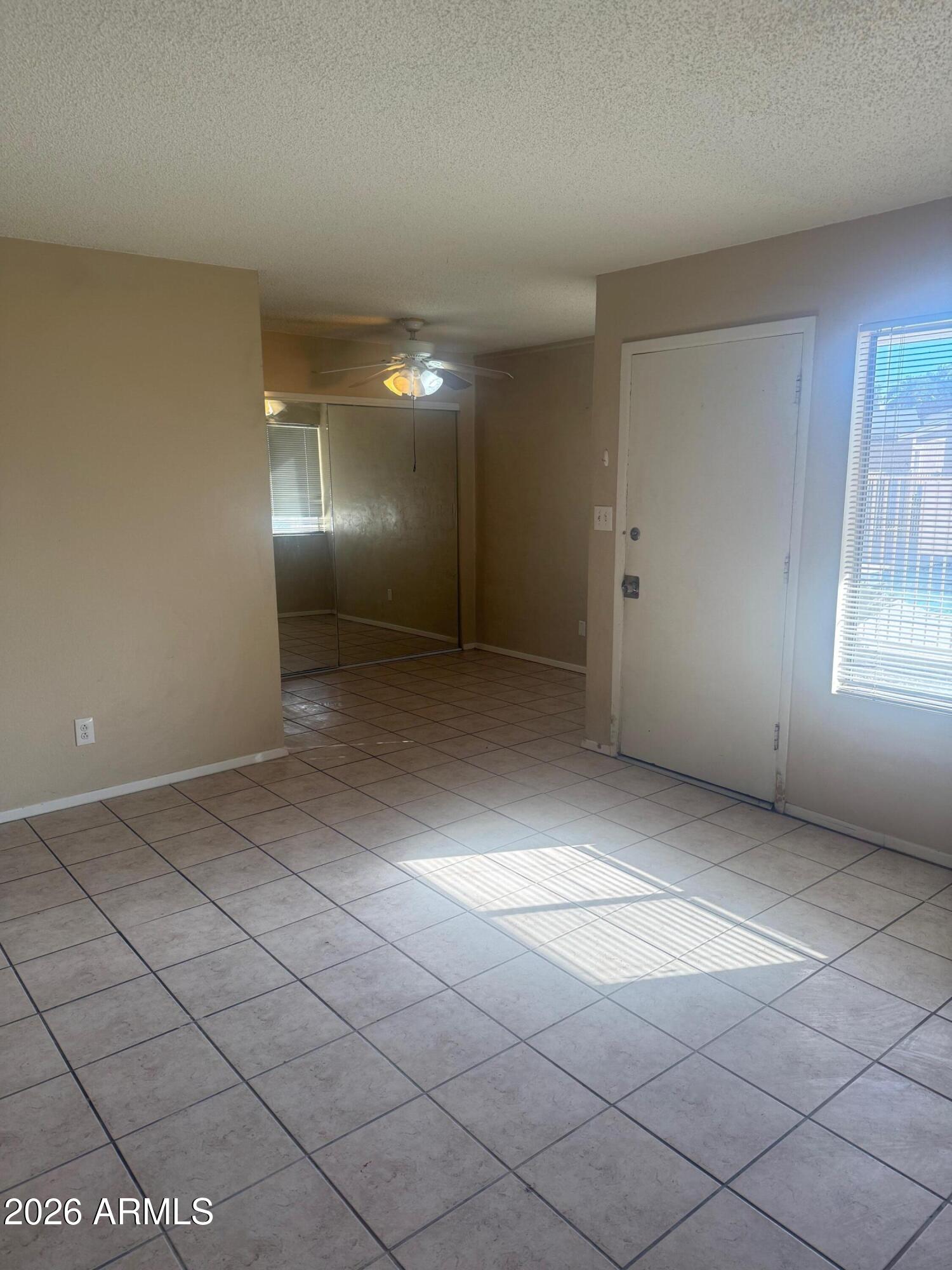 1622 East Campbell Avenue, Unit R Phoenix, AZ 85016 - Photo 2 of 15 an empty room with windows and pillars in it