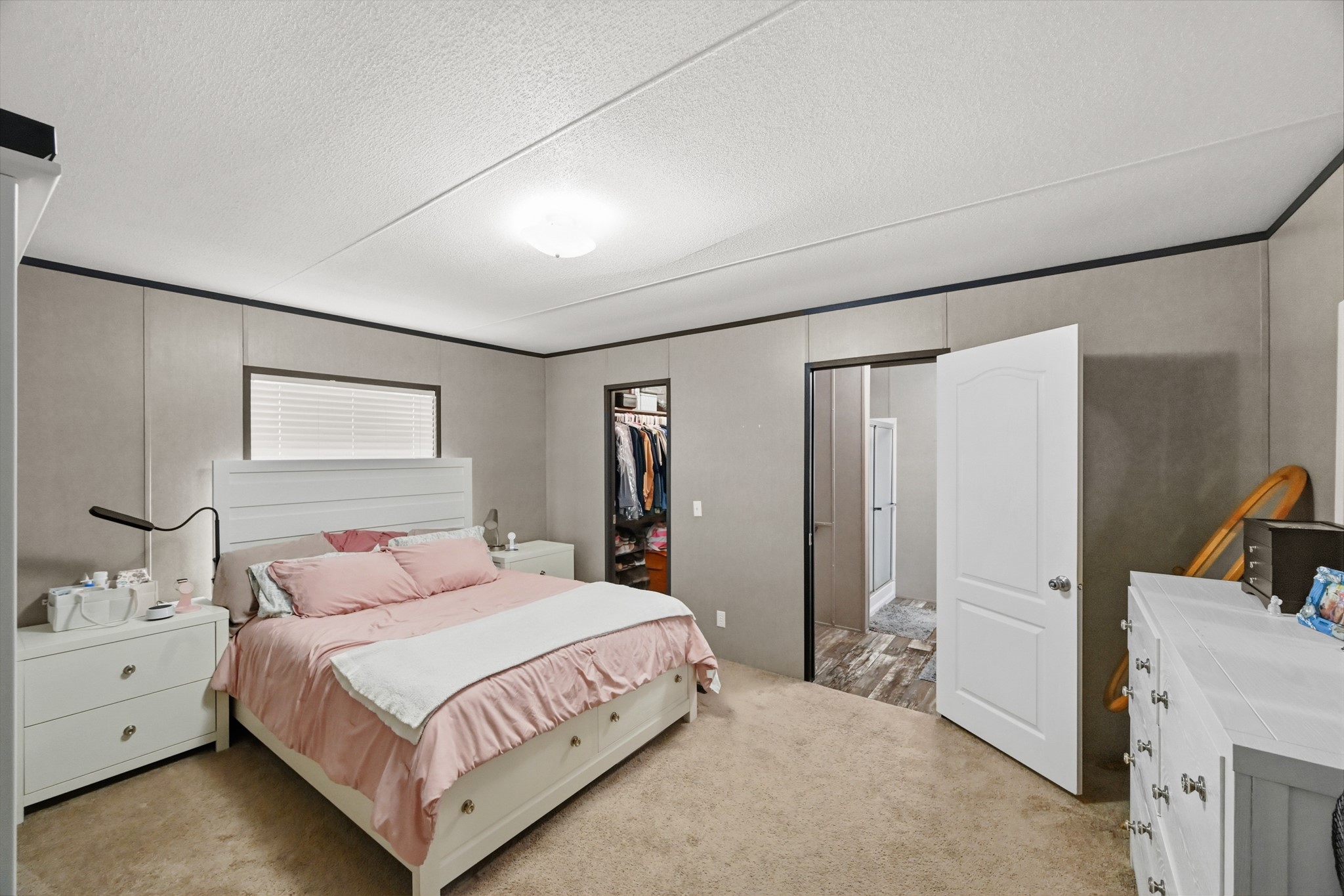 6026 Carter Road Waller, TX 77484 - Photo 15 of 34 a bedroom with a bed and a cabinets