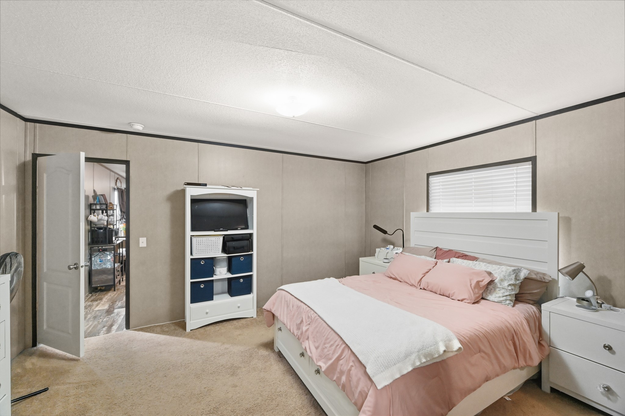 6026 Carter Road Waller, TX 77484 - Photo 16 of 34 a bedroom with a bed and a walk in closet