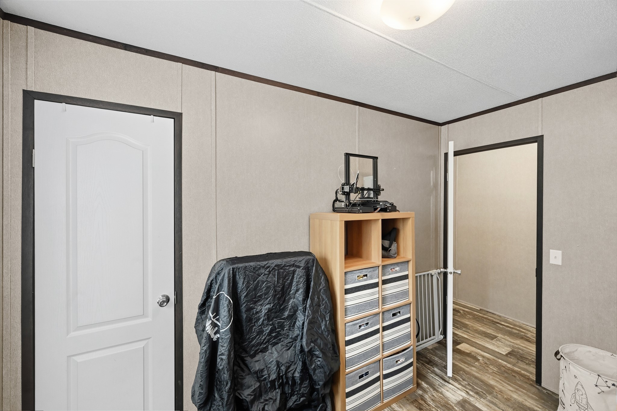 6026 Carter Road Waller, TX 77484 - Photo 26 of 34 a view of walk in closet with wooden floor