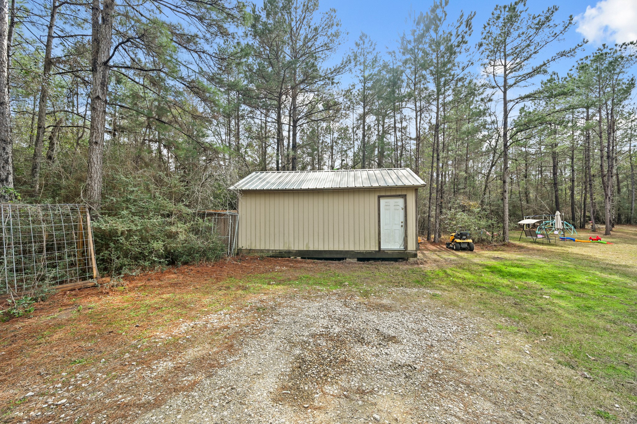 6026 Carter Road Waller, TX 77484 - Photo 28 of 34 a view of a house with a yard and garage
