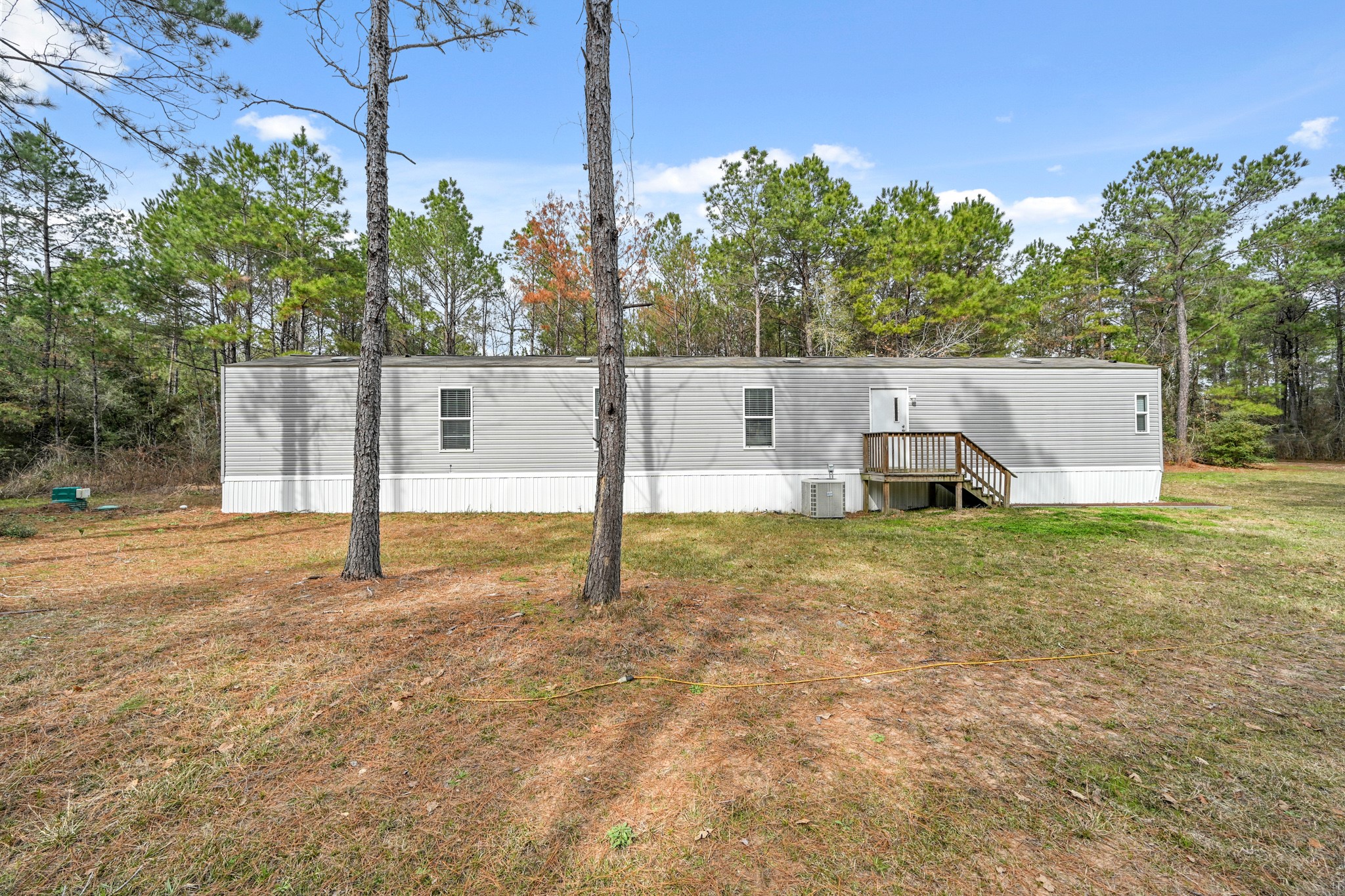6026 Carter Road Waller, TX 77484 - Photo 33 of 34 a view of a house with backyard and a small cabin