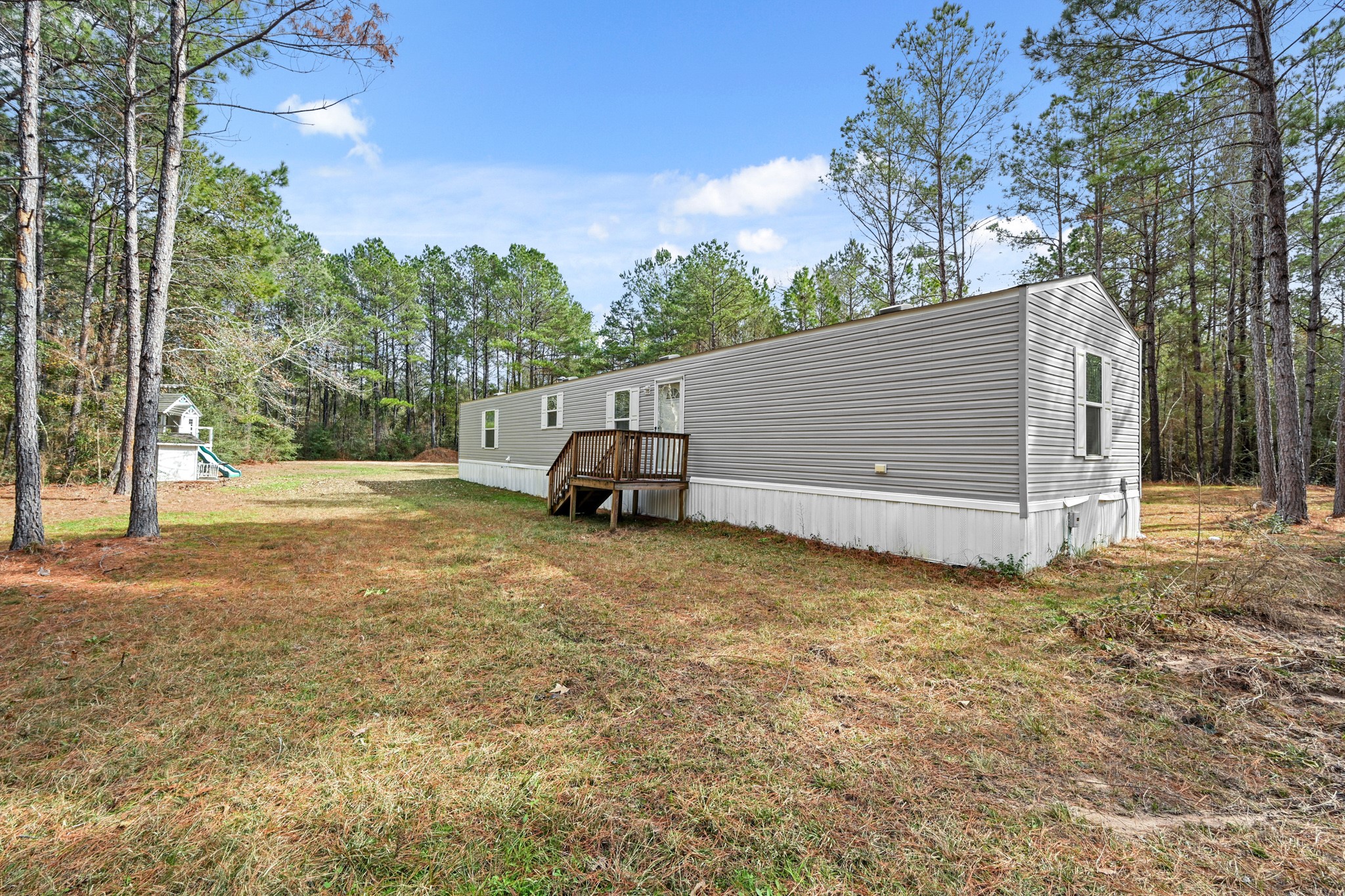 6026 Carter Road Waller, TX 77484 - Photo 4 of 34 a view of backyard with large trees and wooden fence