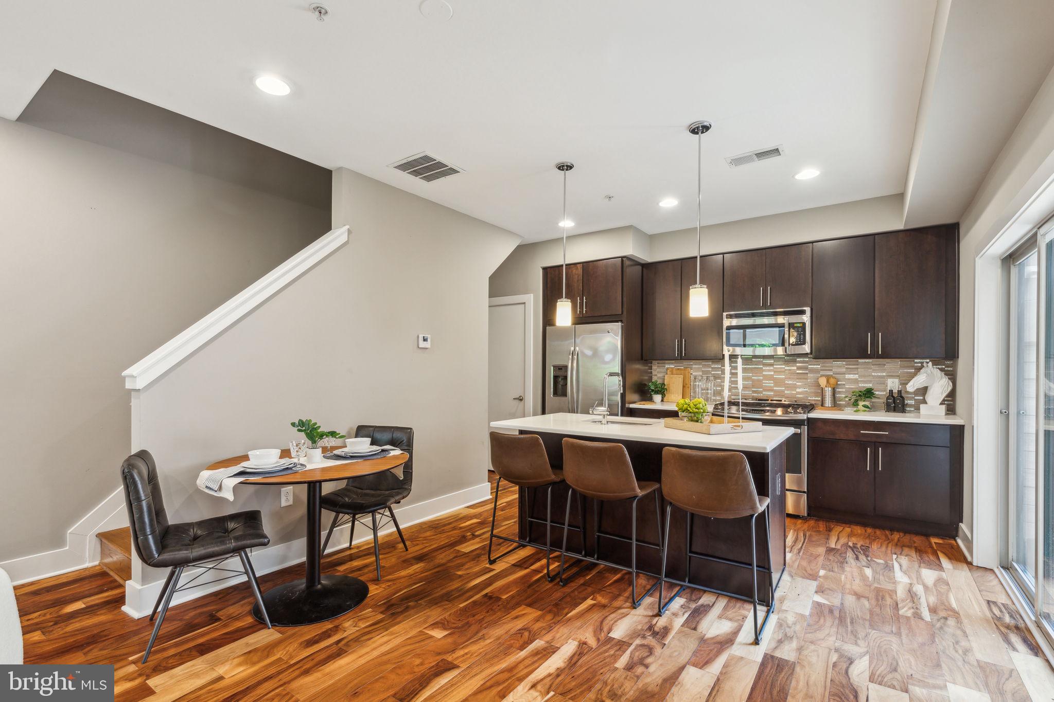 832 North 3rd Street, Unit 7 Philadelphia, PA 19123 - Photo 13 of 52 a kitchen with a table and chairs in it